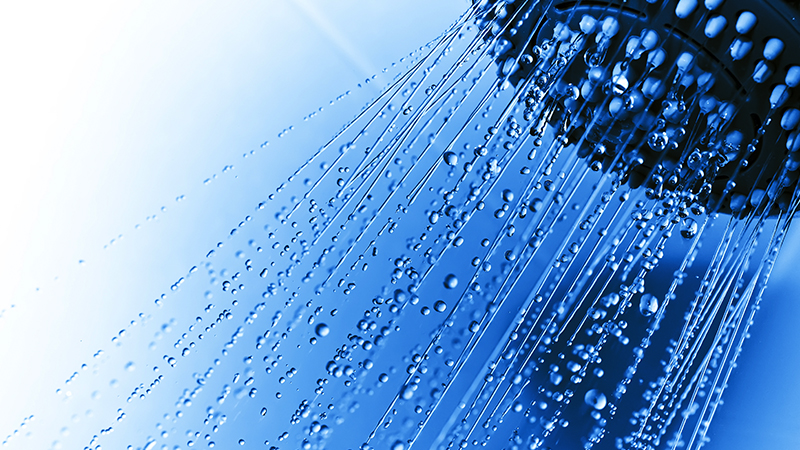 Close up shower blue background