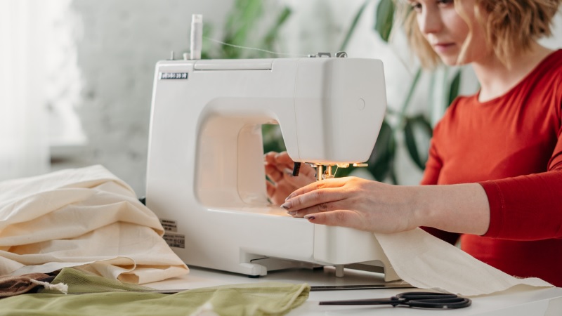 woman using a sewing machine