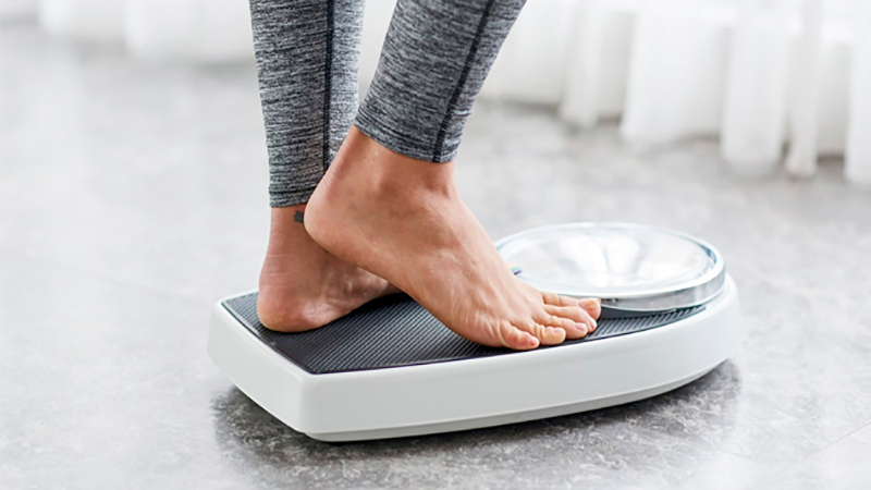 woman standing on scales