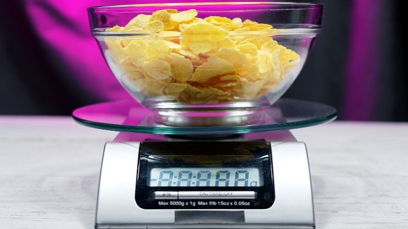 Weighing crisps on a kitchen scale