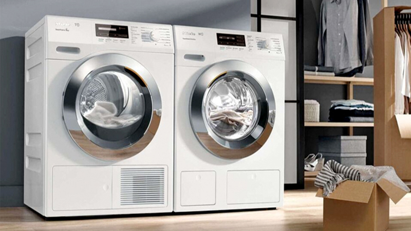 Two white tumble dryers