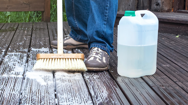 someone cleaning a patio