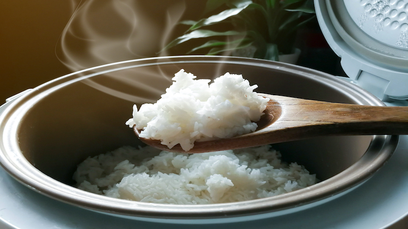 rice on wooden spoon