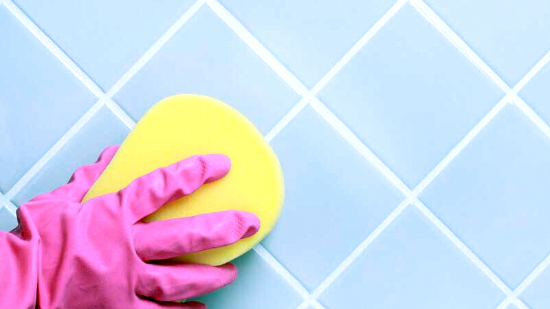 Cleaning blue tiles with white grout