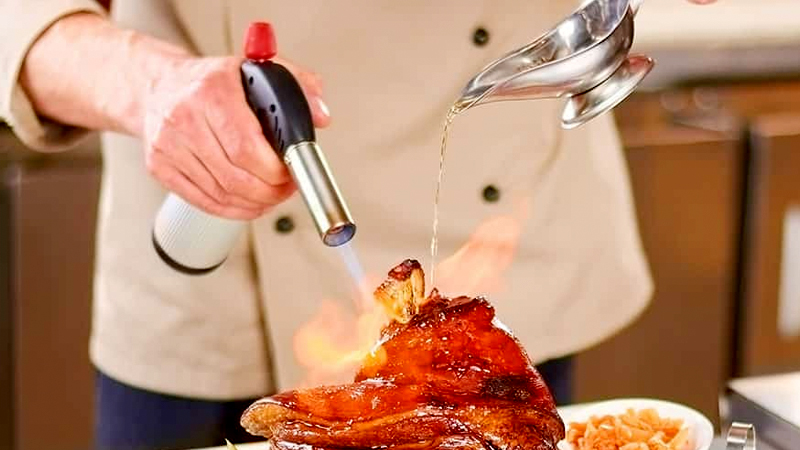 Chef using a blowtorch