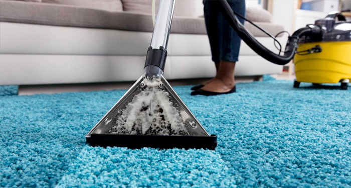 Carpet cleaning a blue carpet