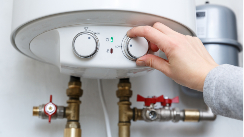 woman turning up boiler